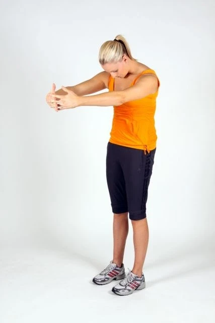 Female performing a Rhomboid Stretch