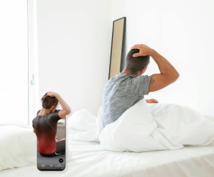 An image of a man stretching his neck in bed as part of a daily stretching routine.