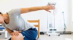 An image of a seated spinal twist stretch improving upper back flexibility and shoulder mobility.