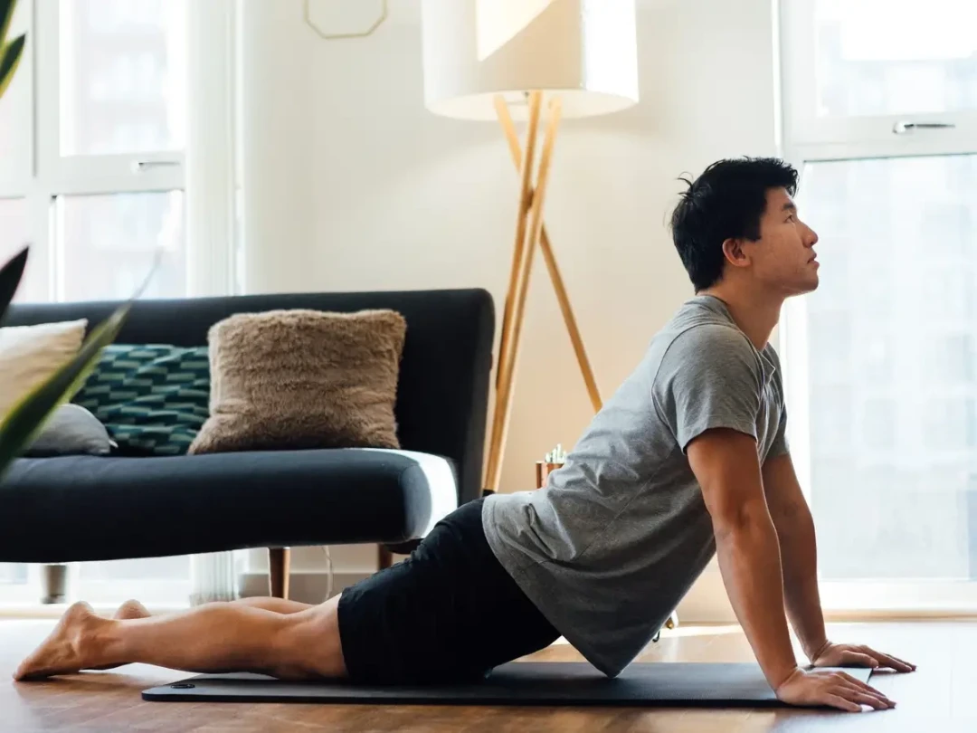 An image of a man performing a trapezius Stretch