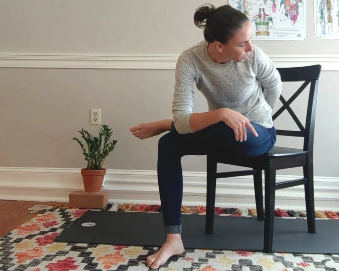 Female performing a Gluteus Medius Stretch